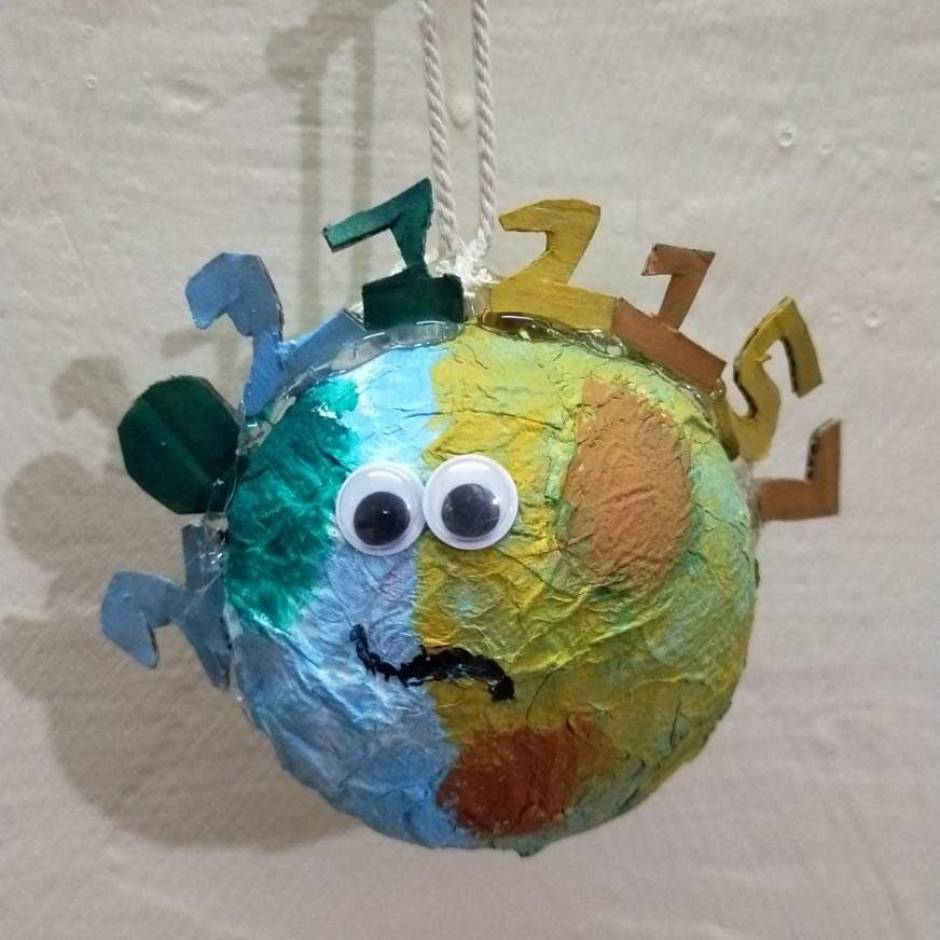 By Sehaj Kaur Bhatia,13. HAPPY EARTH DAy! Waste cricket ball was used to  make earth model and the, newspaper impression art and crayons added little  magic to this poster (drawing and colouring).